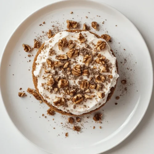 Moist and fluffy air fryer carrot cake topped with cream cheese frosting.