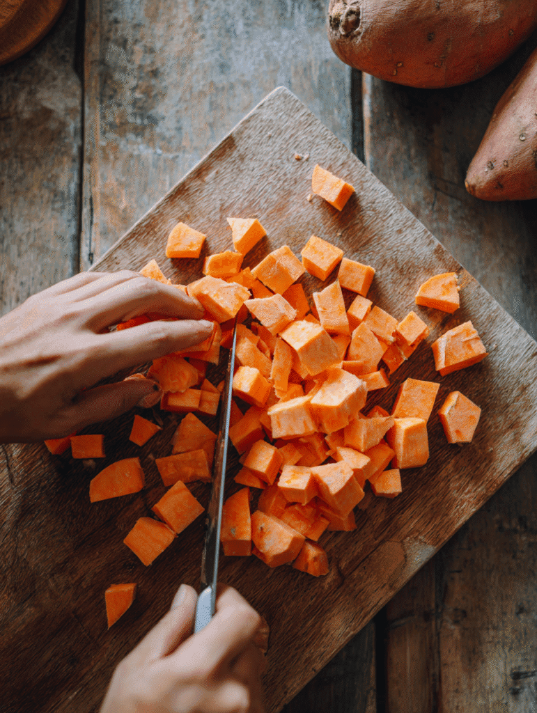 Cutting sweet potatoes into cubes for air frying