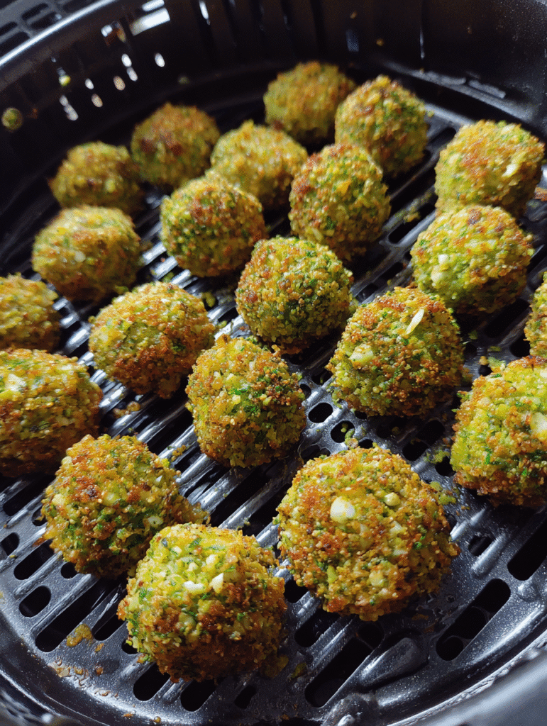air fryer herb-crusted green peas balls mid-cooking