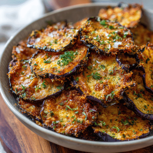 crispy air fryer eggplant chips in a rustic bowl