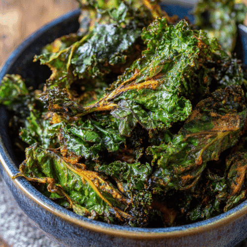 Air Fryer Kale Chips in a bowl with ultra-crispy edges