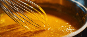 Simmering homemade orange sauce for air fryer orange chicken